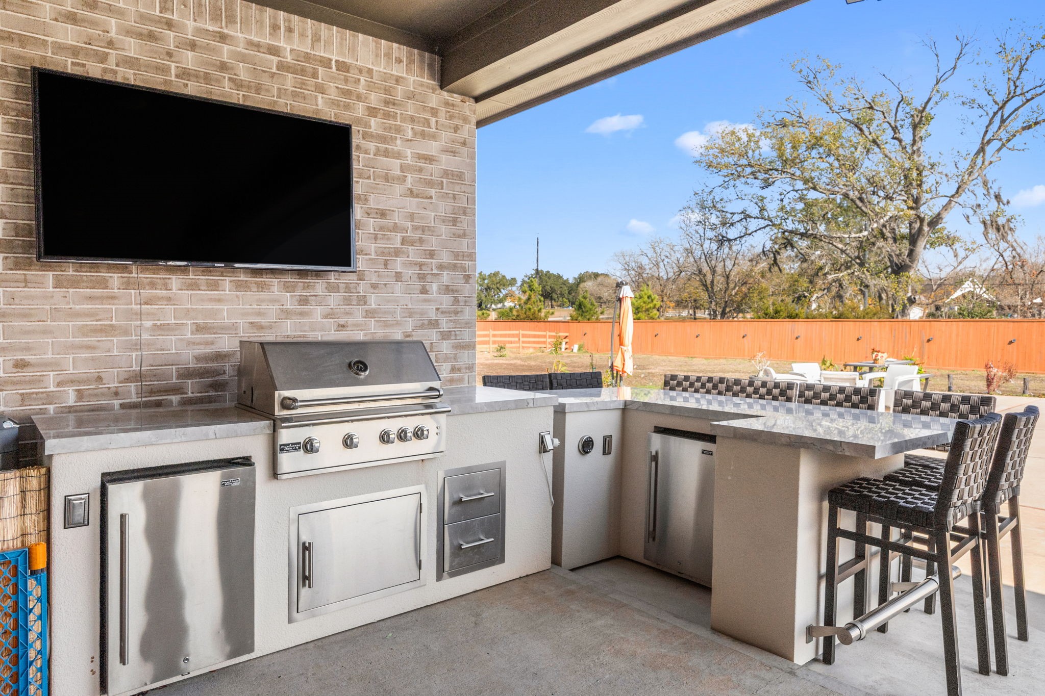 29402 Cir S Rnch Trail Fulshear, TX 77406 - Photo 46 of 50 a kitchen with a stove and a microwave