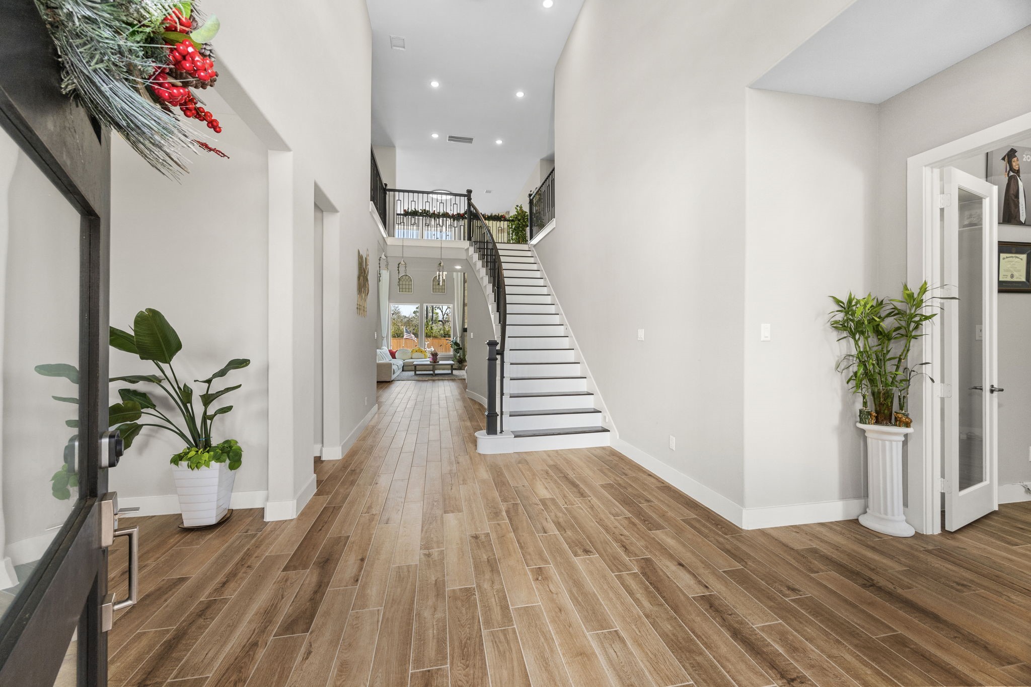 29402 Cir S Rnch Trail Fulshear, TX 77406 - Photo 6 of 50 a view of a hallway with wooden floor and stairs
