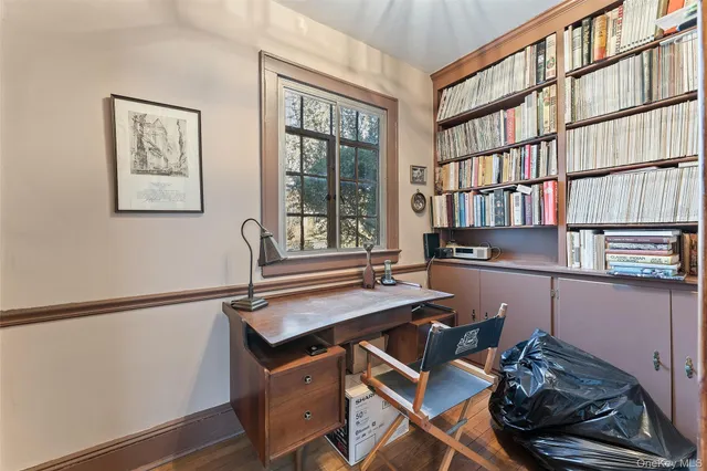 a reading room with furniture and book shelf