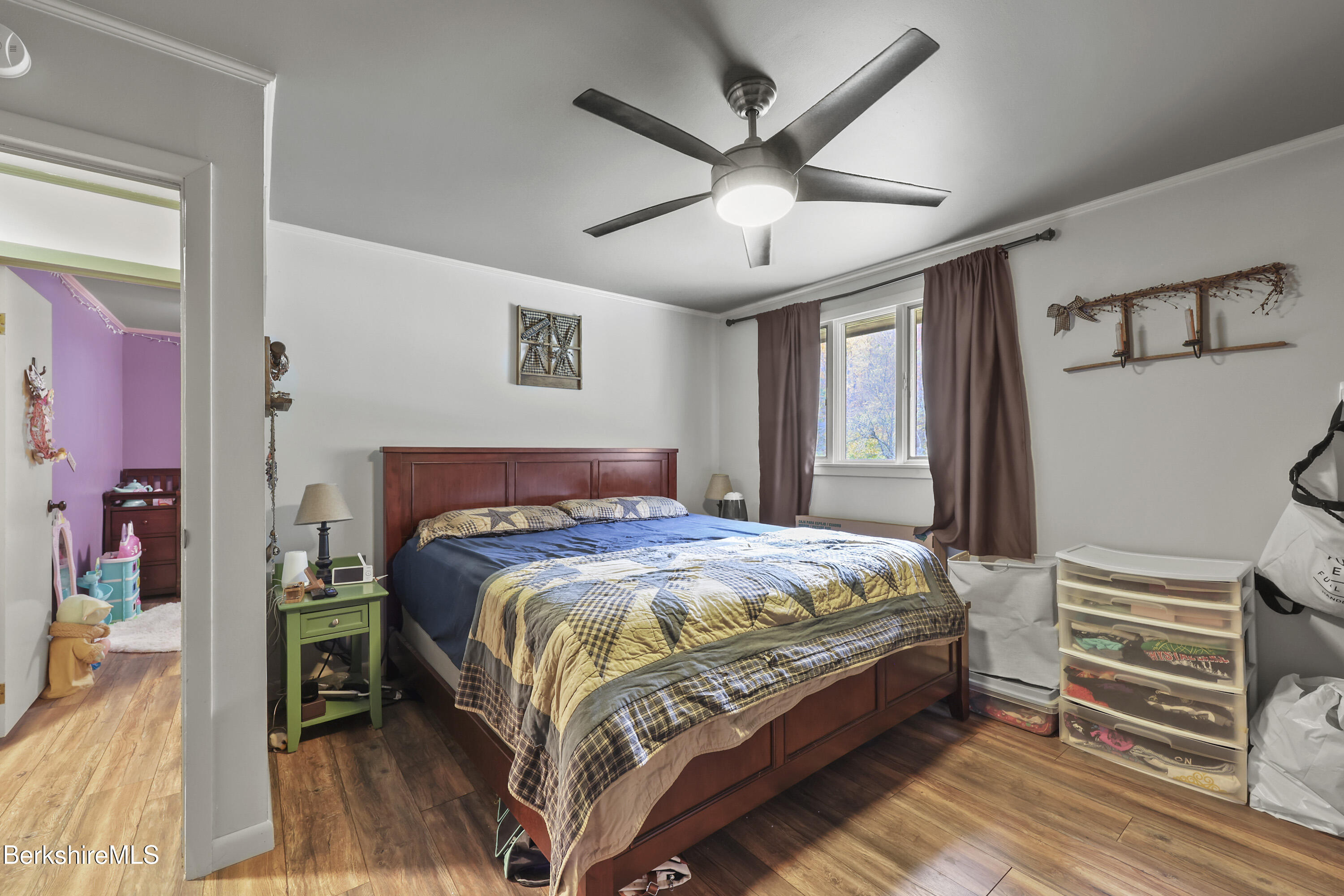 490 Kirchner Road Dalton, MA 01226 - Photo 15 of 30 a bedroom with a bed and a chandelier