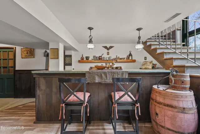 a living room with lots of furniture and air equipment