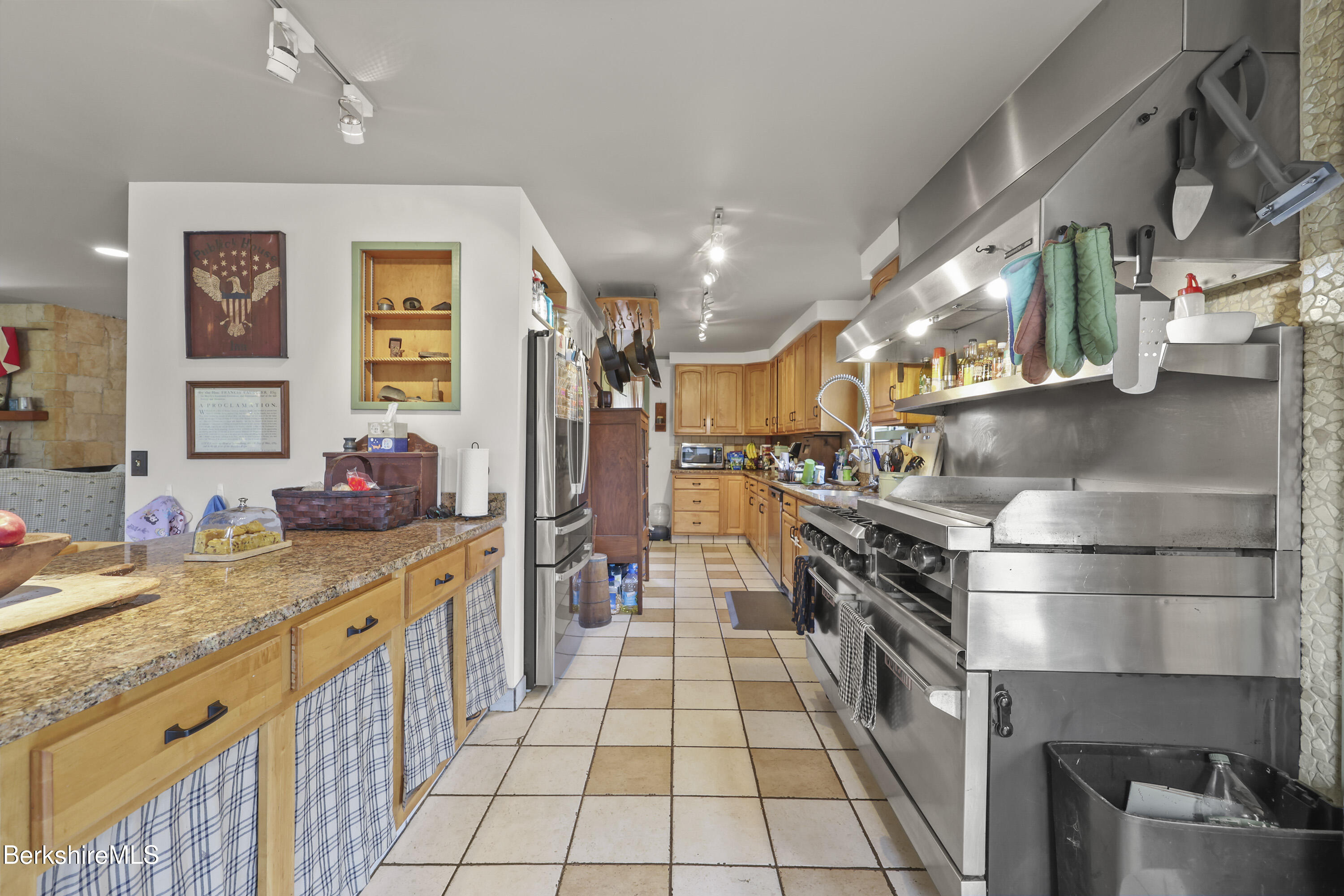 490 Kirchner Road Dalton, MA 01226 - Photo 6 of 30 a kitchen with stainless steel appliances kitchen island granite countertop a stove a sink and a refrigerator