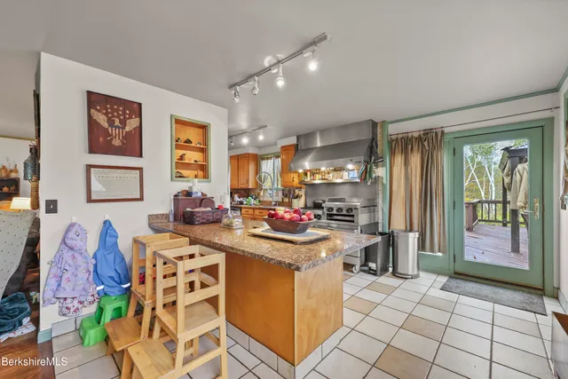 a view of a kitchen with furniture and windows