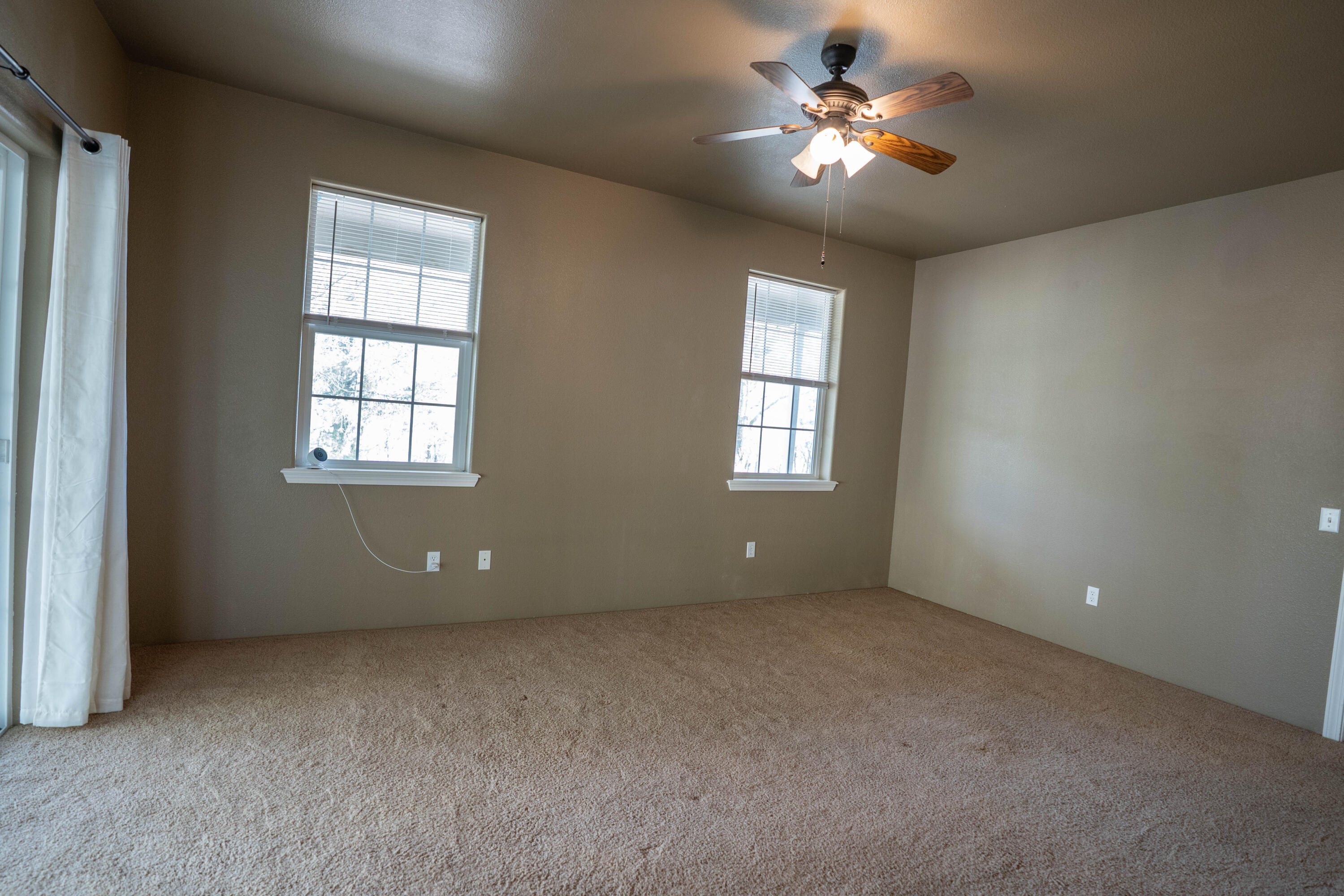 2080 Swingle Road Trail, OR 97541 - Photo 11 of 52 Primary suite filled with natural light from windows.