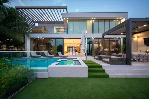 a front view of a house with garden and patio