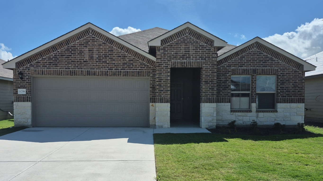178 Rearden Boulevard Jarrell, TX 76537 - Photo 1 of 20 a front view of house with yard