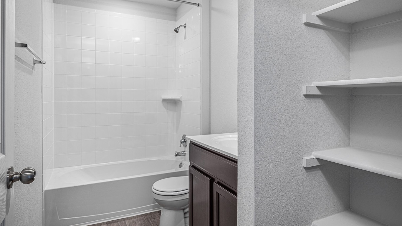 178 Rearden Boulevard Jarrell, TX 76537 - Photo 19 of 20 a bathroom with a sink a toilet and shower