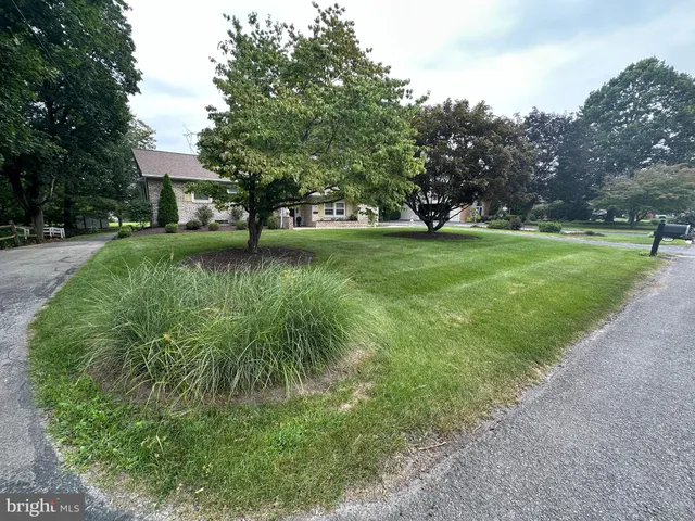 a backyard of a house with lots of green space