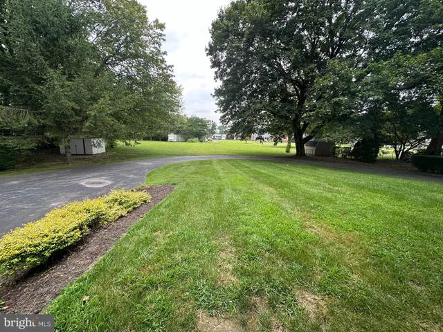 a kitchen with stainless steel appliances sink a stove and cabinets