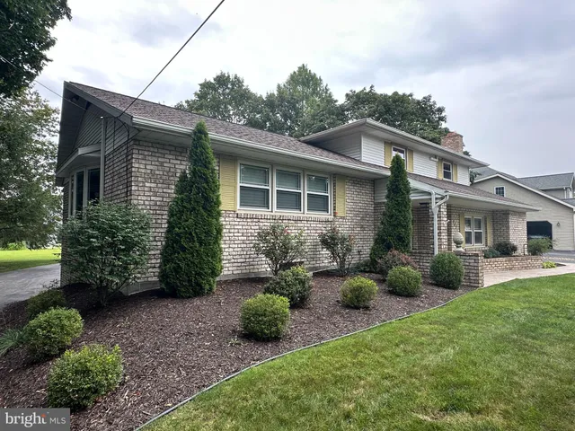 a front view of a house with street
