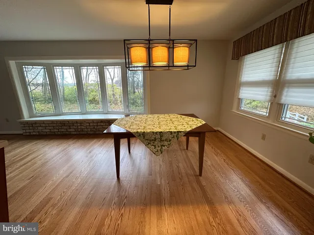 a stove top oven sitting inside of a kitchen