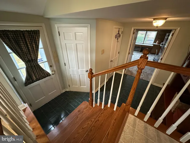 a bedroom with bed and window