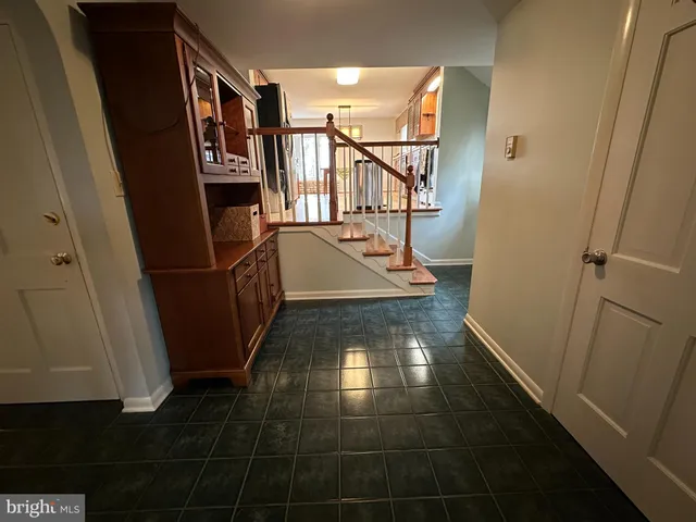 a bed room with a bed and a chair