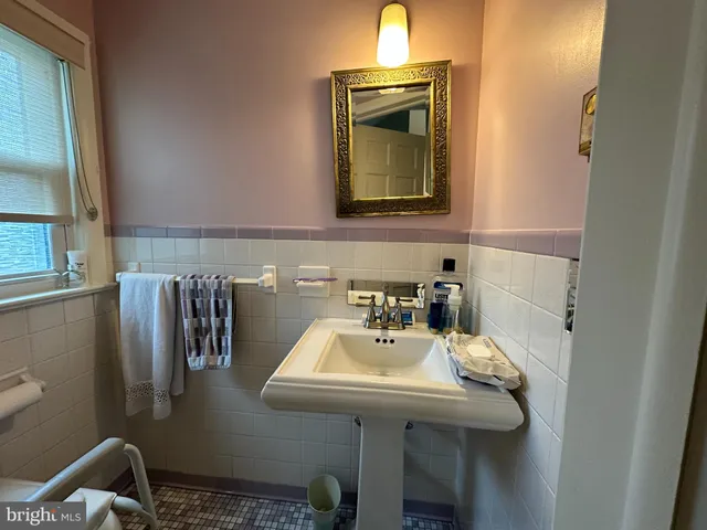 a bathroom with a sink a vanity and shower