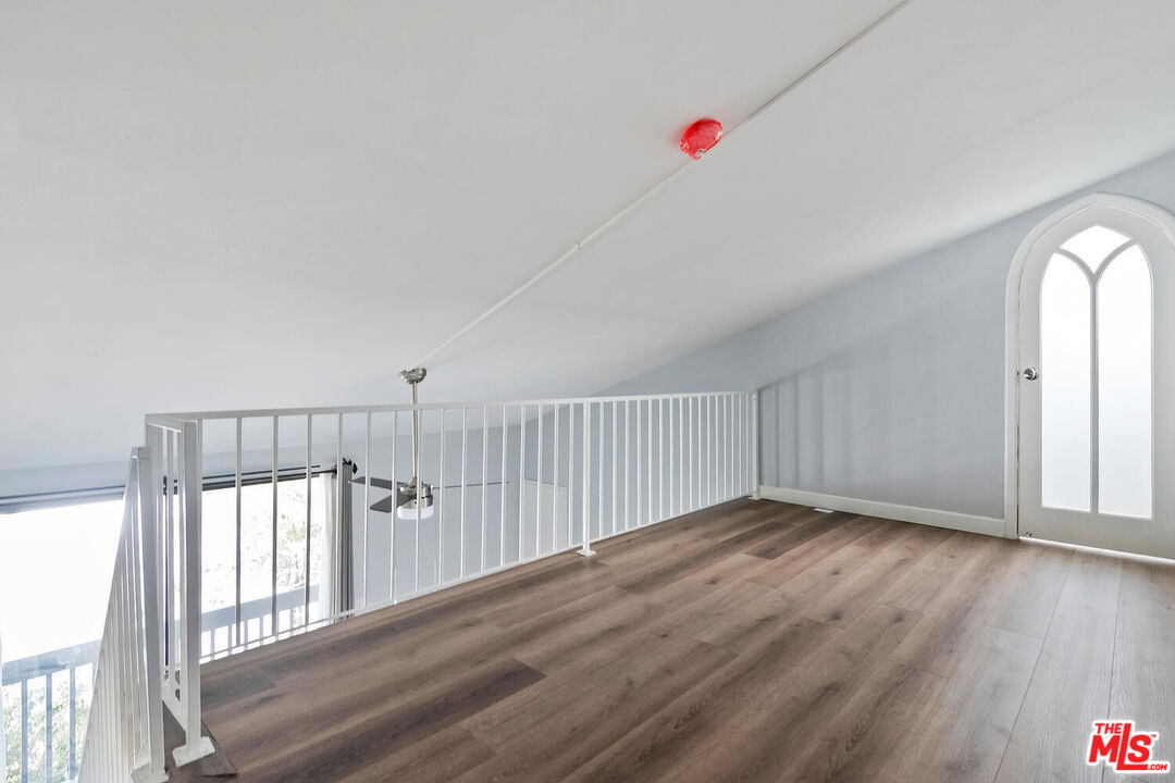 29239 Heathercliff Road, Unit 12 Malibu, CA 90265 - Photo 25 of 32 a view of an entryway with wooden floor
