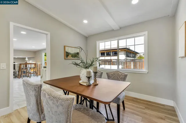 a dining room with furniture and window