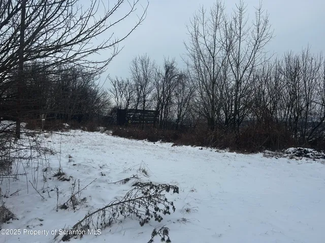 a view of snow on the road