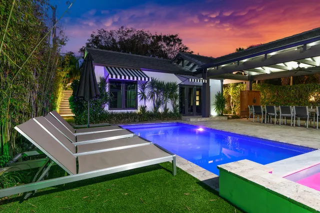 a view of a patio with a table and chairs