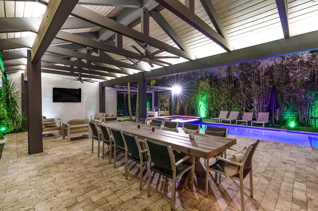 a living room with fireplace furniture and a wooden floor