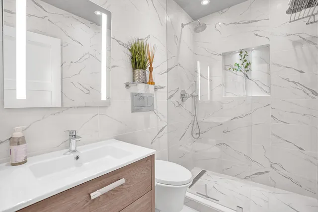 a view of a bedroom with washer and dryer