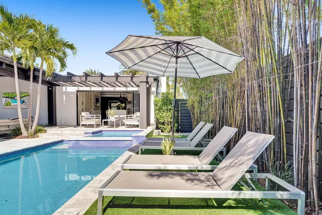 a view of a patio with a table and chairs