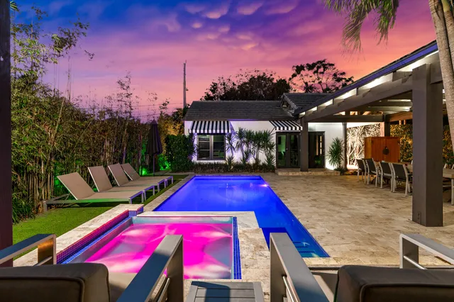 a view of swimming pool with a patio