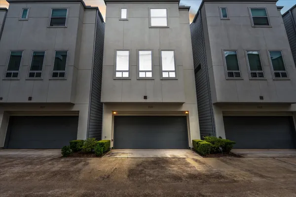 a front view of a house with a garage