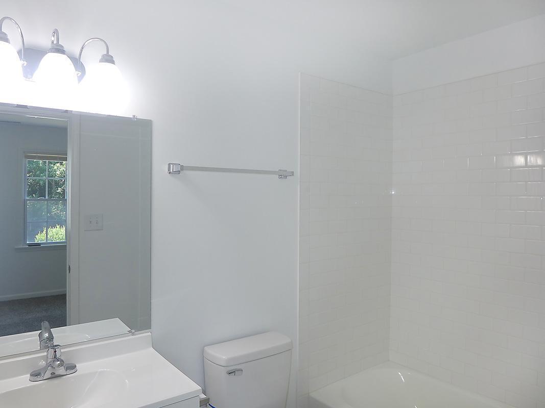 101 Rock Haven Road, Unit G704 Carrboro, NC 27510 - Photo 14 of 24 a bathroom with a sink and toilet