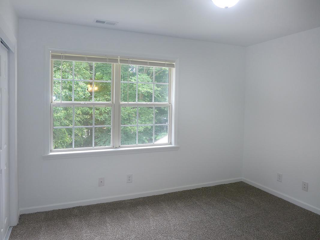 101 Rock Haven Road, Unit G704 Carrboro, NC 27510 - Photo 15 of 24 an empty room with a window
