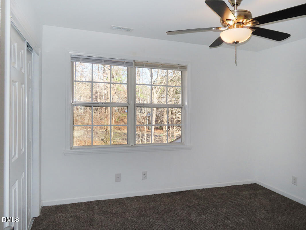 101 Rock Haven Road, Unit G704 Carrboro, NC 27510 - Photo 15 of 24 an empty room with a window