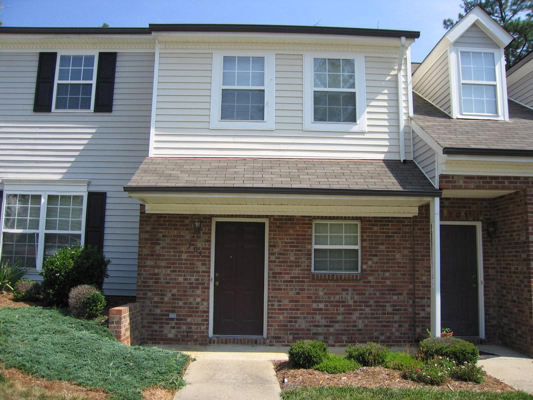 101 Rock Haven Road, Unit G704 Carrboro, NC 27510 - Photo 19 of 24 a front view of a house with garden