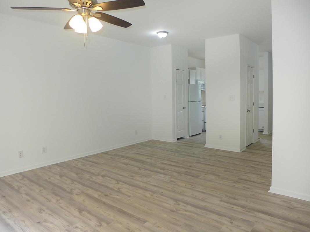 101 Rock Haven Road, Unit G704 Carrboro, NC 27510 - Photo 5 of 24 a view of empty room with wooden floor
