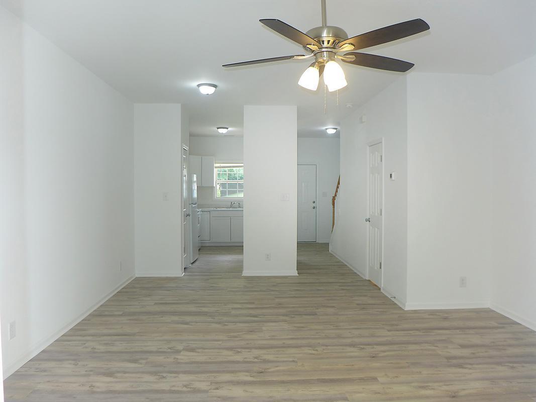 101 Rock Haven Road, Unit G704 Carrboro, NC 27510 - Photo 6 of 24 wooden floor in an empty room with a window