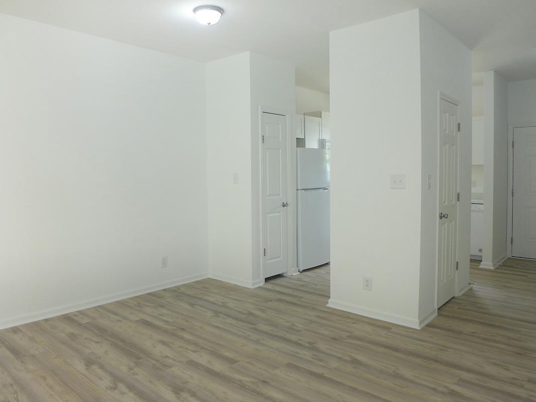 101 Rock Haven Road, Unit G704 Carrboro, NC 27510 - Photo 8 of 24 a view of an empty room with wooden floor