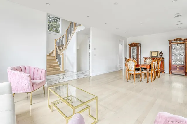 a living room with furniture and white walls