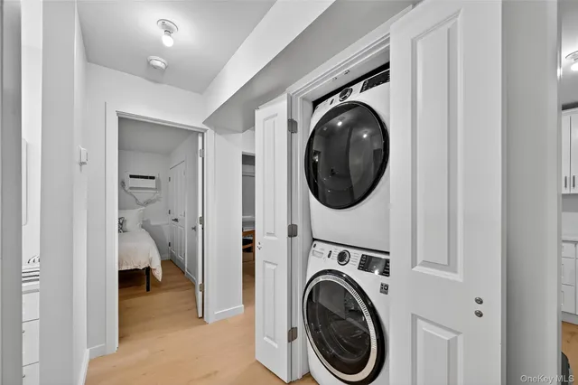 a view of a hallway with washer and dryer