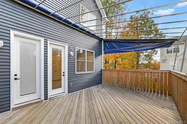 a view of a porch with wooden floor