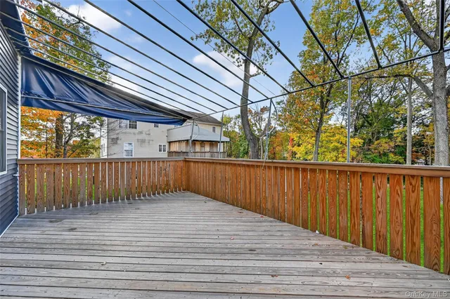 a view of balcony with wooden floor