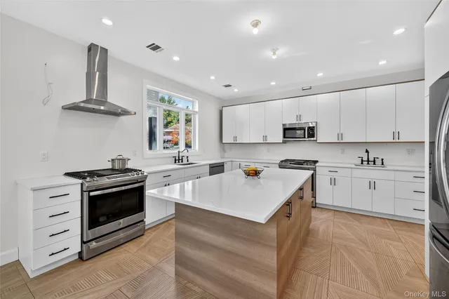 a kitchen with a stove a sink and a refrigerator
