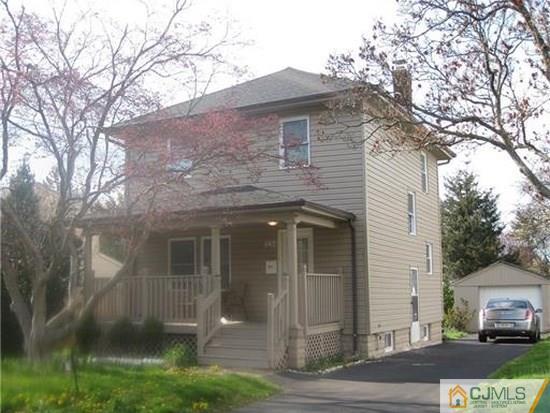 534 Chain O' Hills Road Colonia, NJ 07067 - Photo 1 of 6 a front view of a house with a yard