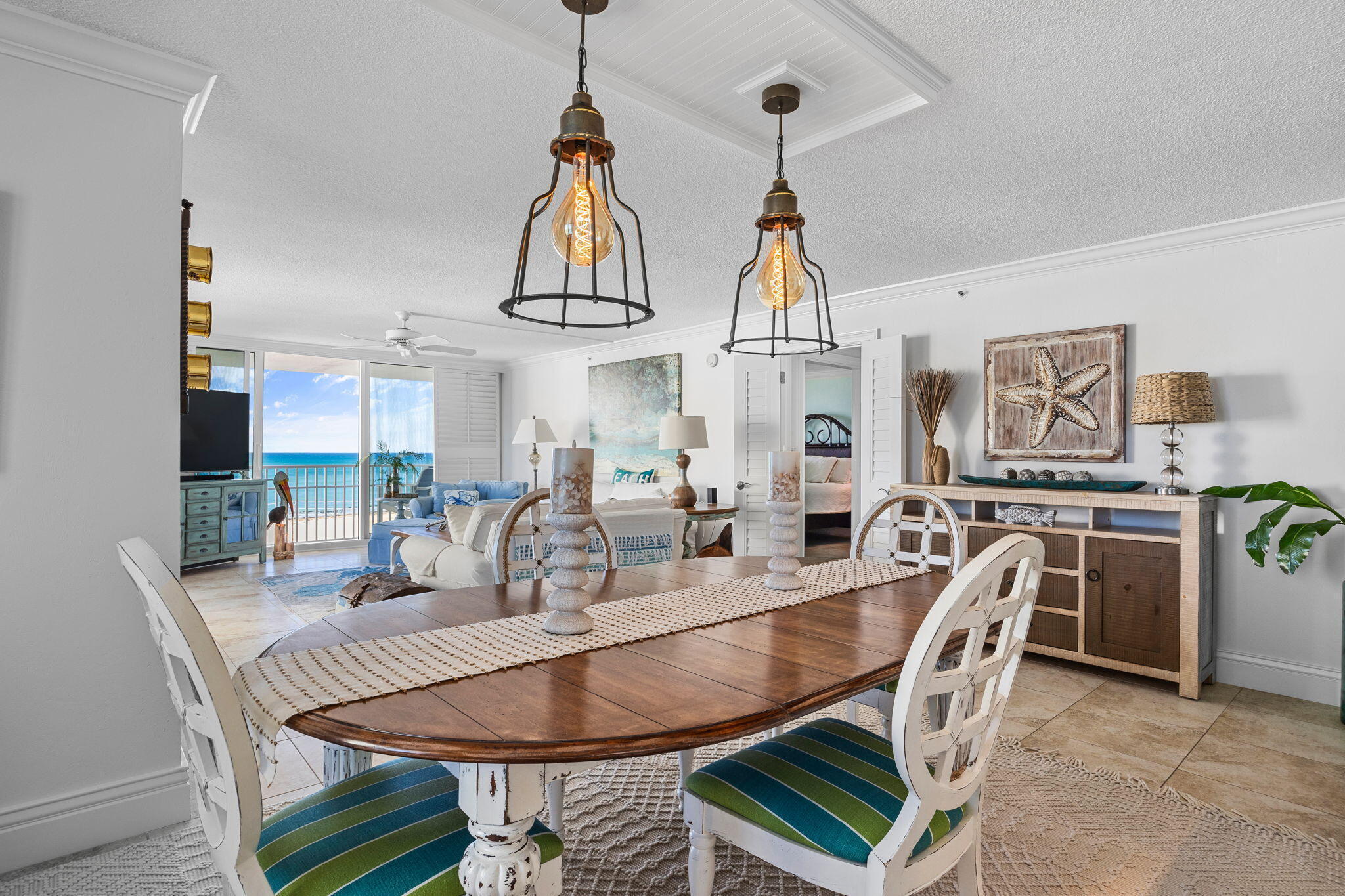 375 South Beach Road, Unit 802 Tequesta, FL 33469 - Photo 11 of 39 a dining room with furniture a chandelier and wooden floor