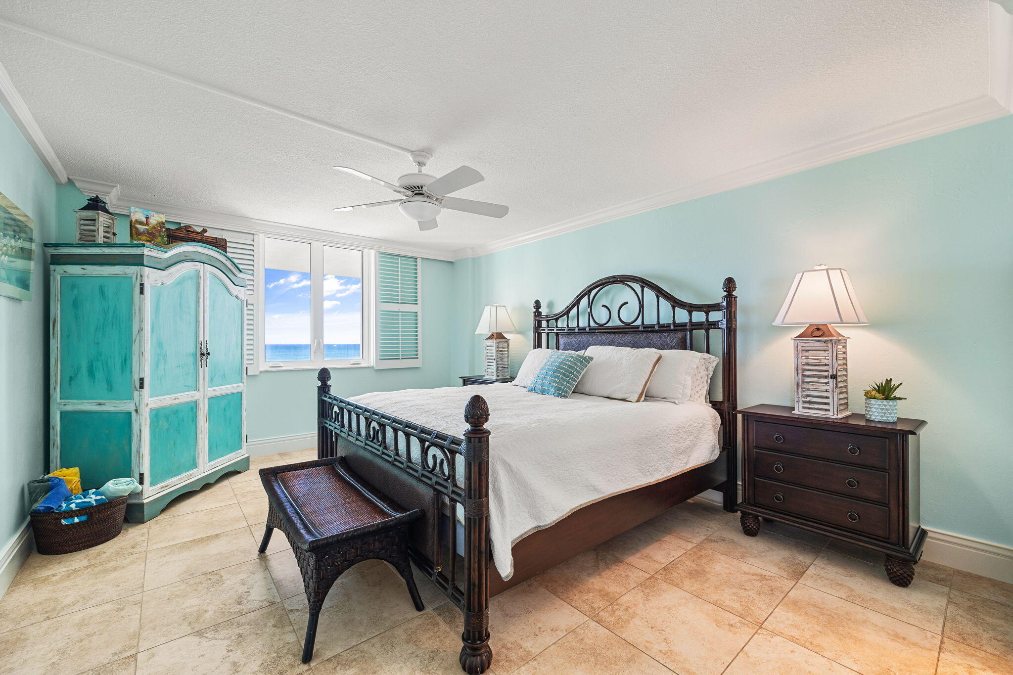 375 South Beach Road, Unit 802 Tequesta, FL 33469 - Photo 18 of 39 a bedroom with a bed and a chandelier