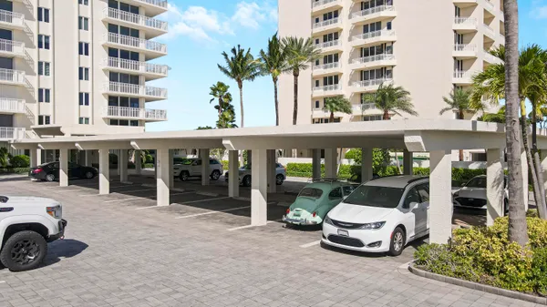 a front view of a building with parking space
