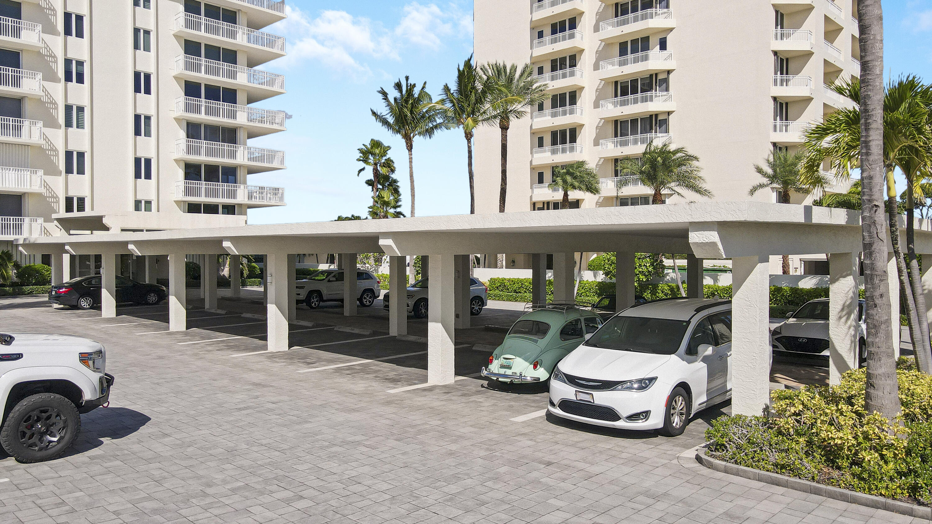 375 South Beach Road, Unit 802 Tequesta, FL 33469 - Photo 3 of 39 a front view of a building with parking space
