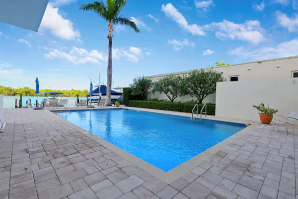 a view of a swimming pool with a lounge chairs