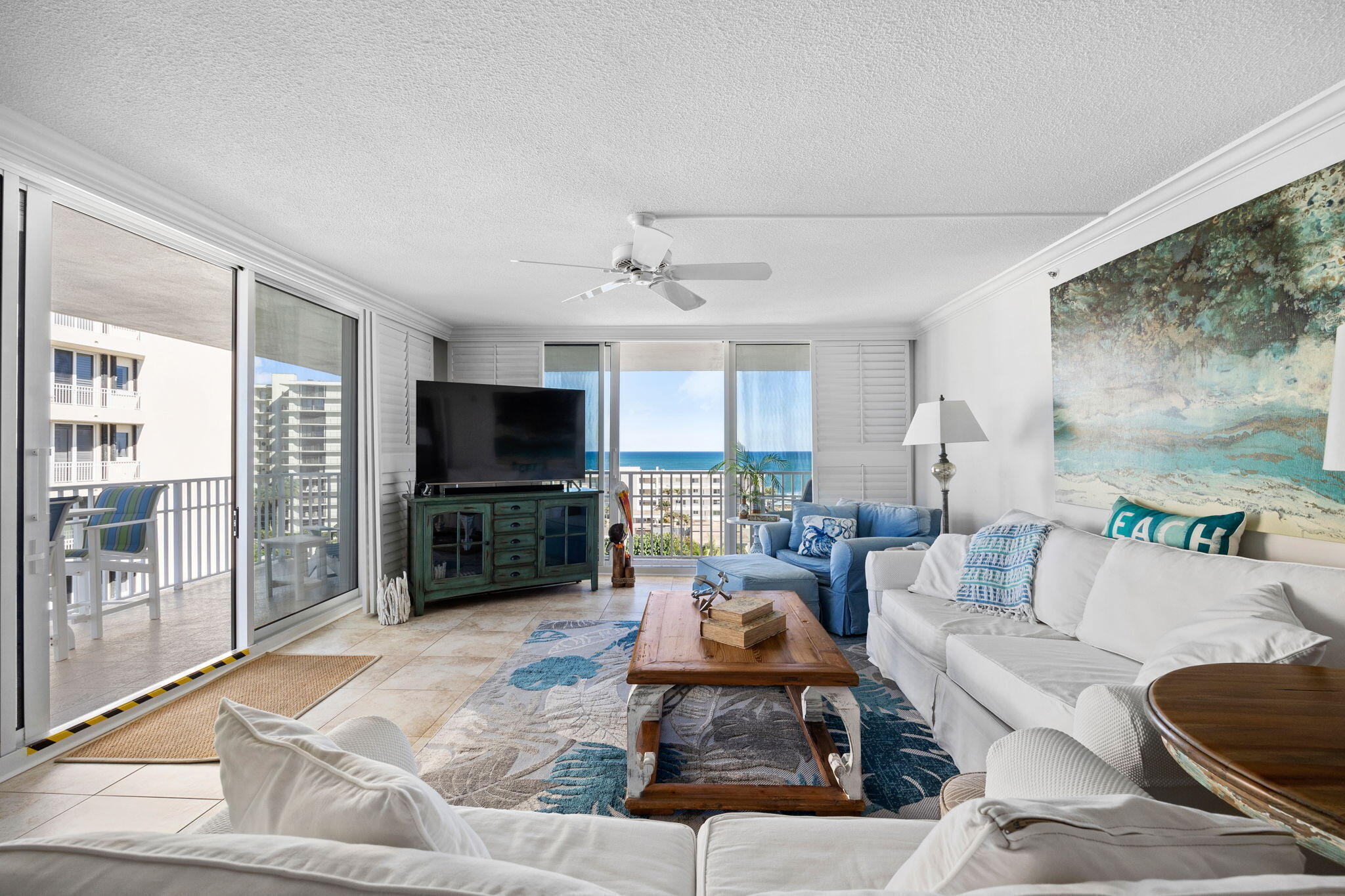 375 South Beach Road, Unit 802 Tequesta, FL 33469 - Photo 9 of 39 a living room with furniture and a flat screen tv