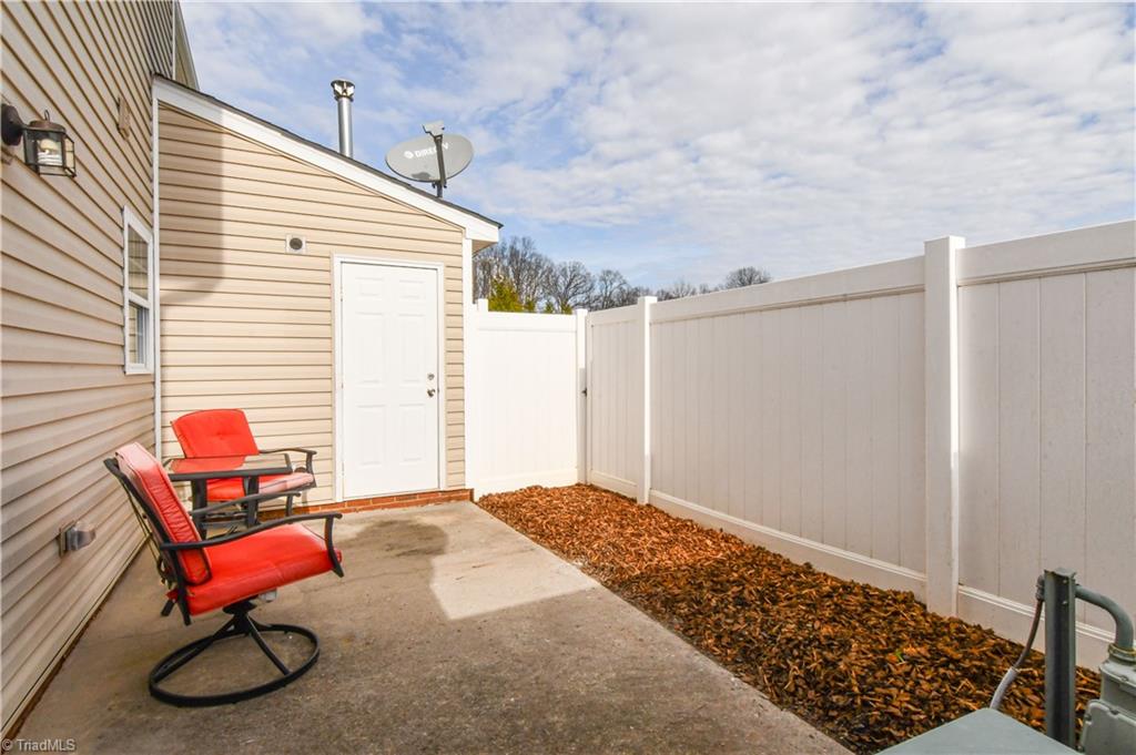 467 Ansley Way High Point, NC 27265 - Photo 15 of 16 Hard to find private oasis within townhome living. Privacy fence, storage room, and freshly mulched.