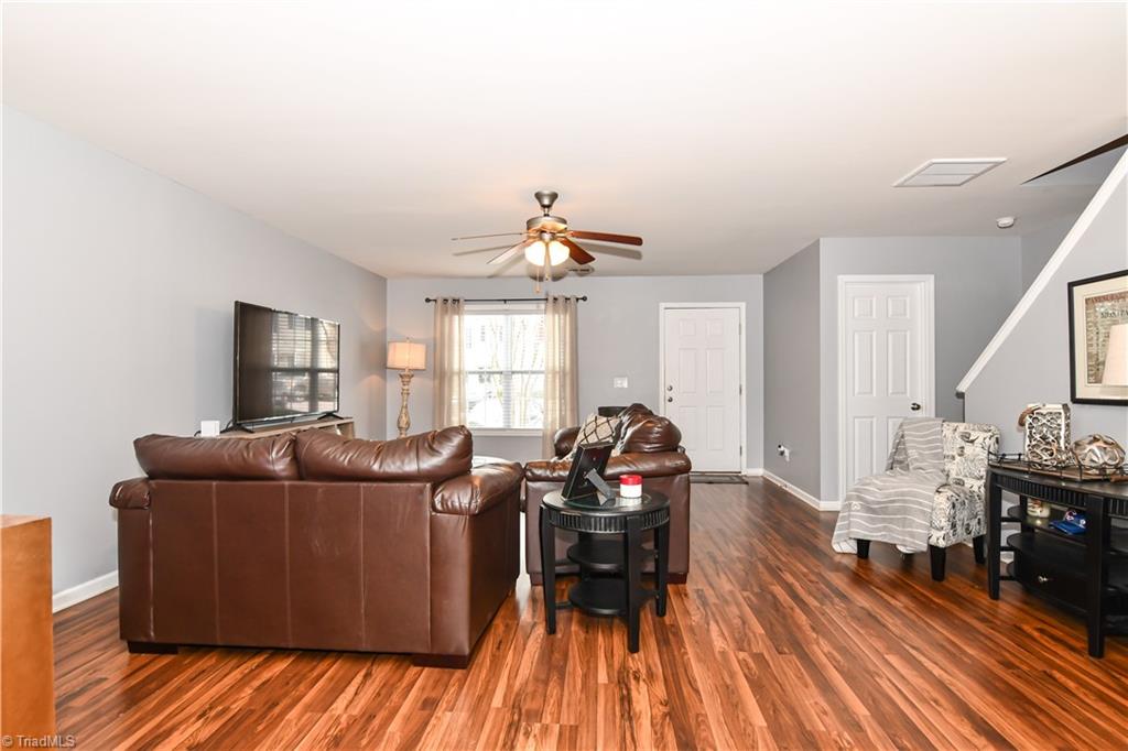 467 Ansley Way High Point, NC 27265 - Photo 2 of 16 The living room is huge! Wood laminate flooring, double window, ceiling fan w/light, large coat closet.