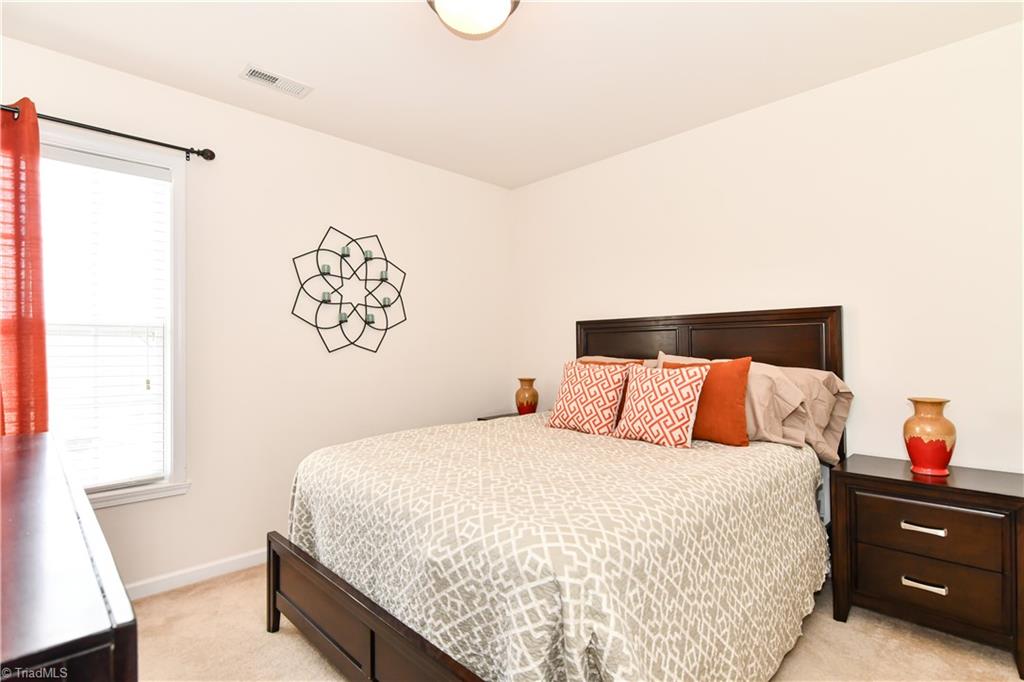 467 Ansley Way High Point, NC 27265 - Photo 9 of 16 The 2nd bedroom is a mirror image of 3rd bedroom. Spacious secondary bedrooms and neutral decor, both easy access to the hall full bath.