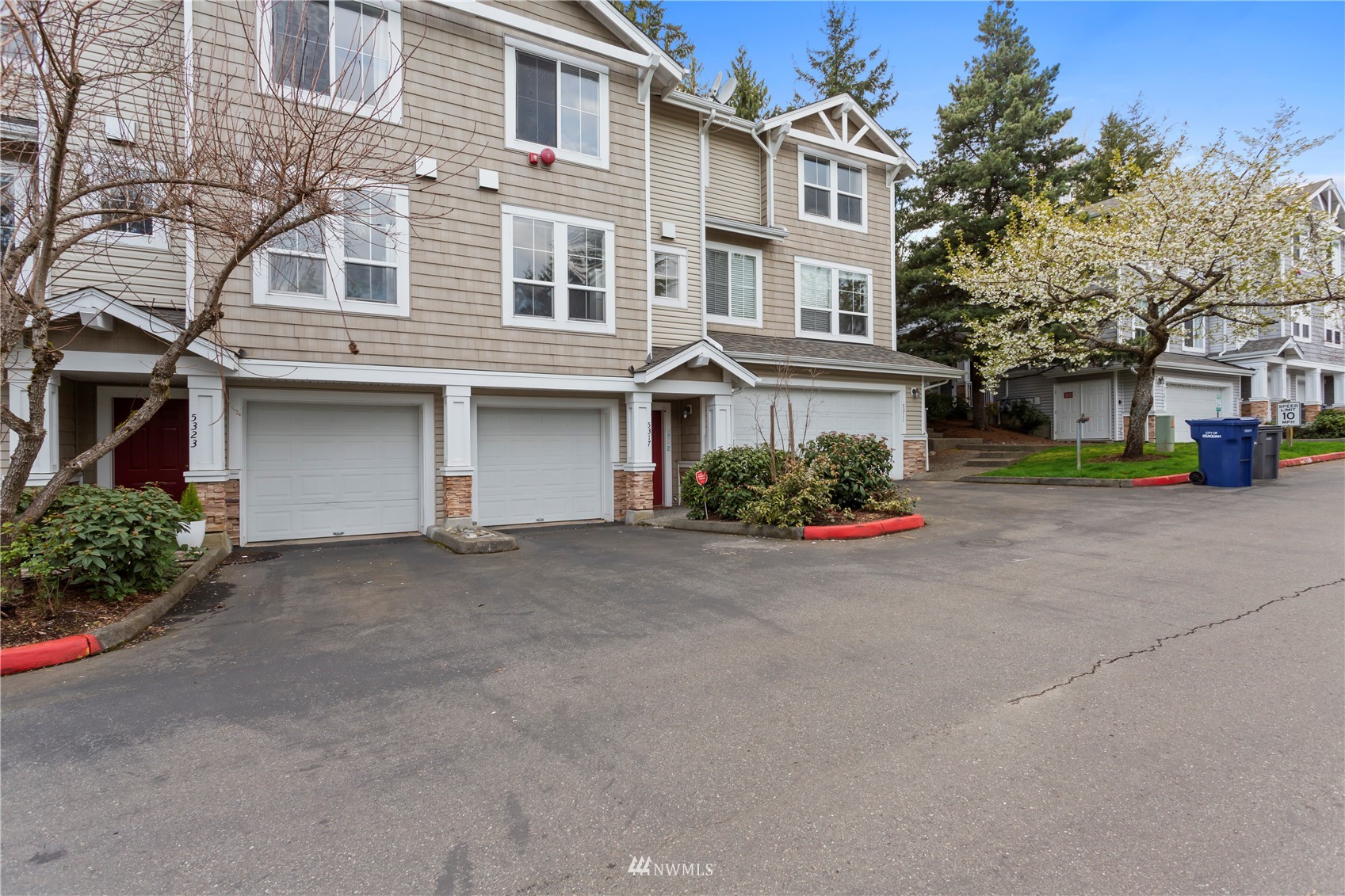 5317 236th Place Southeast, Unit 3 Sammamish, WA 98029 - Photo 1 of 29 front view of a building with a street